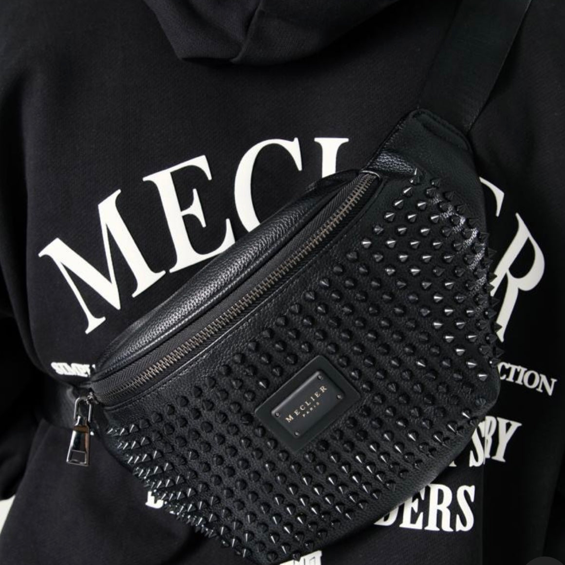 RIÑONERA MECLIER TACHE NEGRO